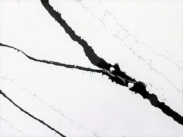 Close-up of black ink lines on white paper.