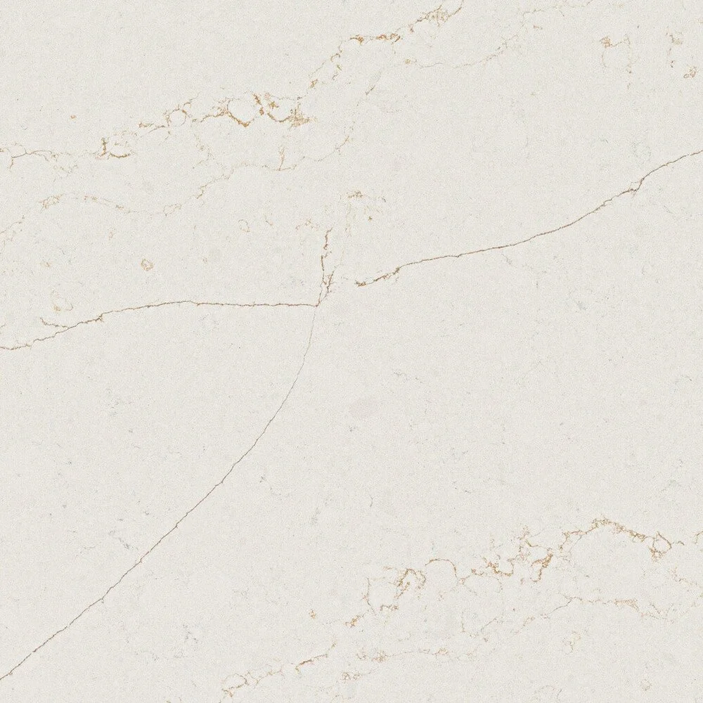 Close-up of a white marble surface with subtle beige veining.