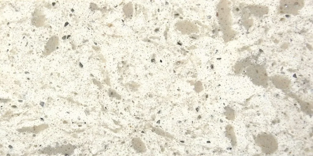 Close-up of a speckled beige and black granite countertop surface.