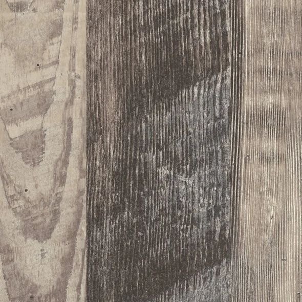 Close-up of a wooden surface with visible grain and texture in different shades of gray and brown.