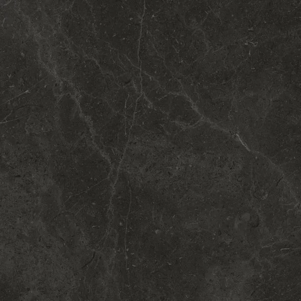 A close-up of a dark gray or black textured surface, possibly a stone or marble material.