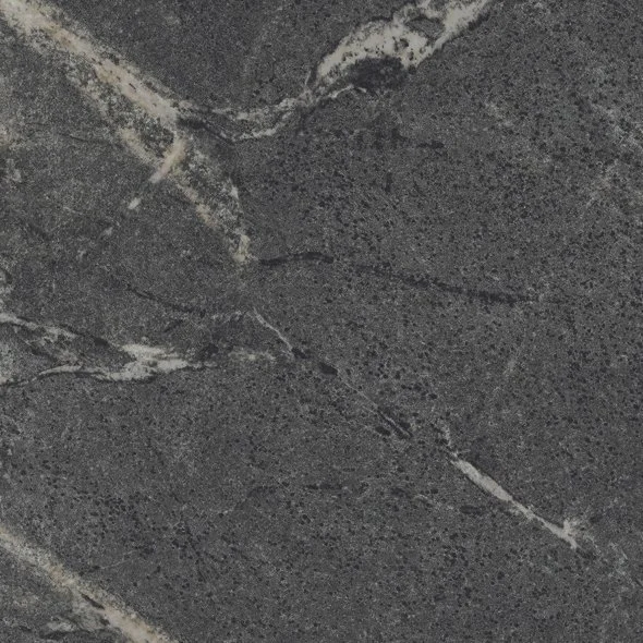 Close-up of a dark gray stone or marble surface with white veining.