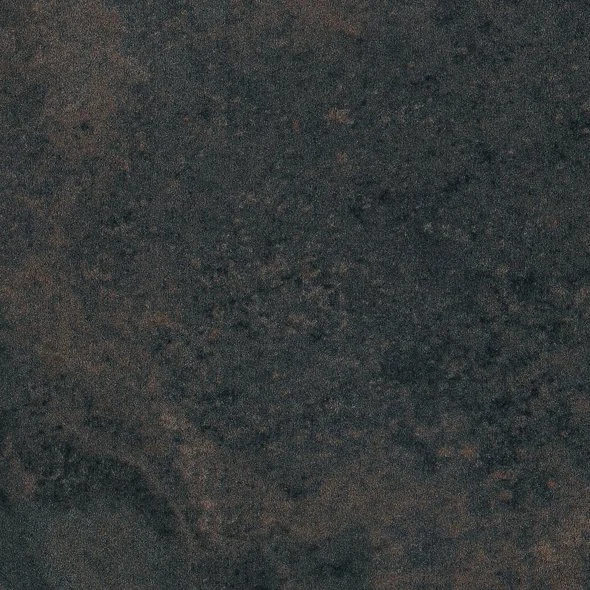 Close-up photo of a dark, textured stone or granite surface.