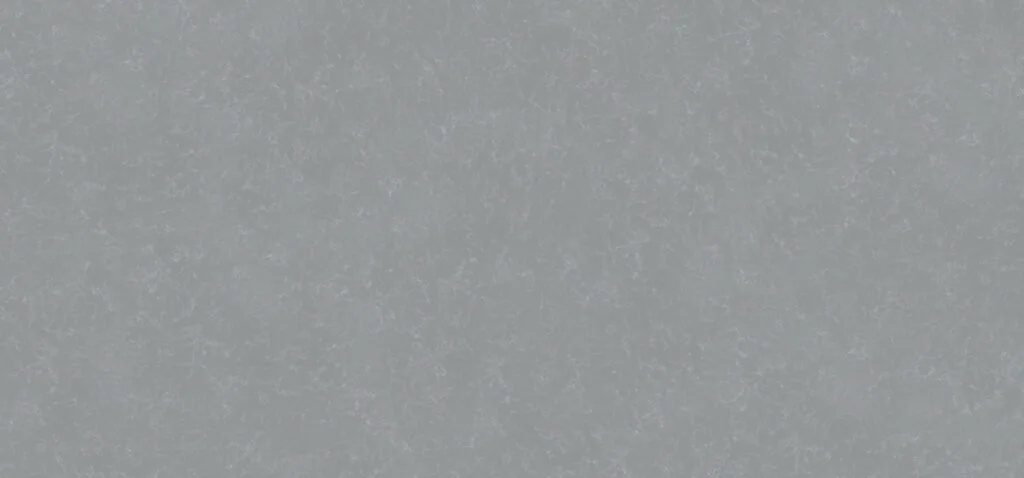 Close-up of a textured, light gray surface, possibly a wall or ceiling, with a speckled pattern.