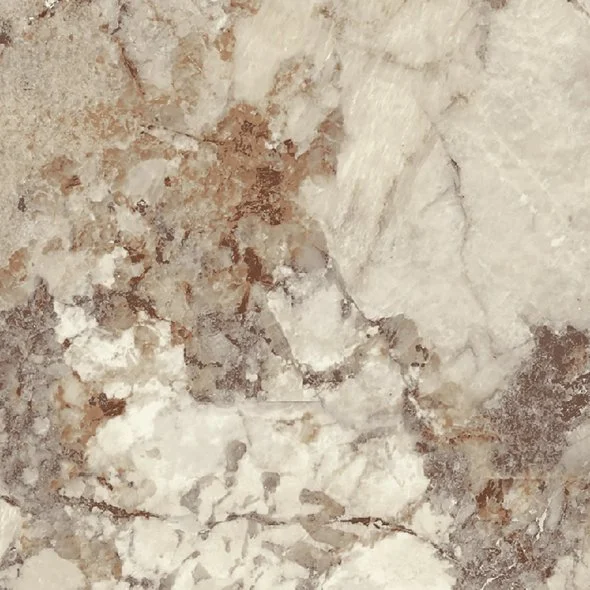 Close-up of a marble surface with beige, white, and brown tones and natural veining patterns.