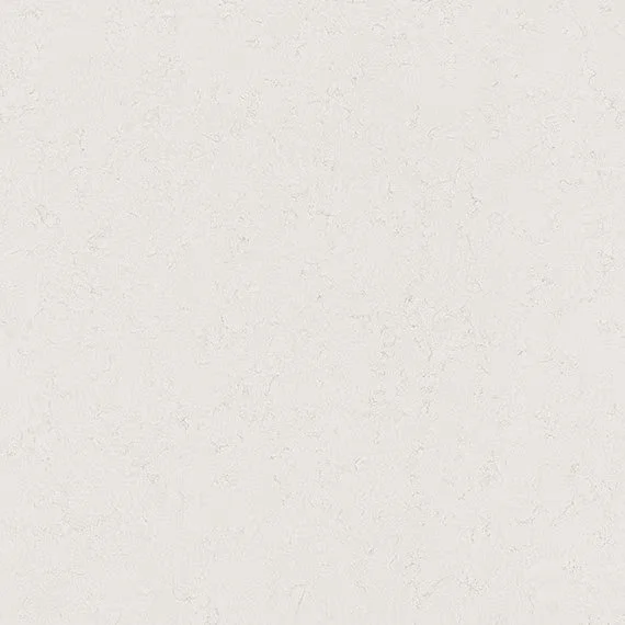 A blank, light-colored wall with a slightly textured surface.