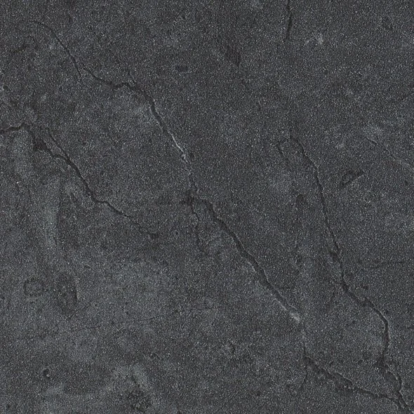 Close-up of a textured black or dark gray concrete surface with visible cracks.