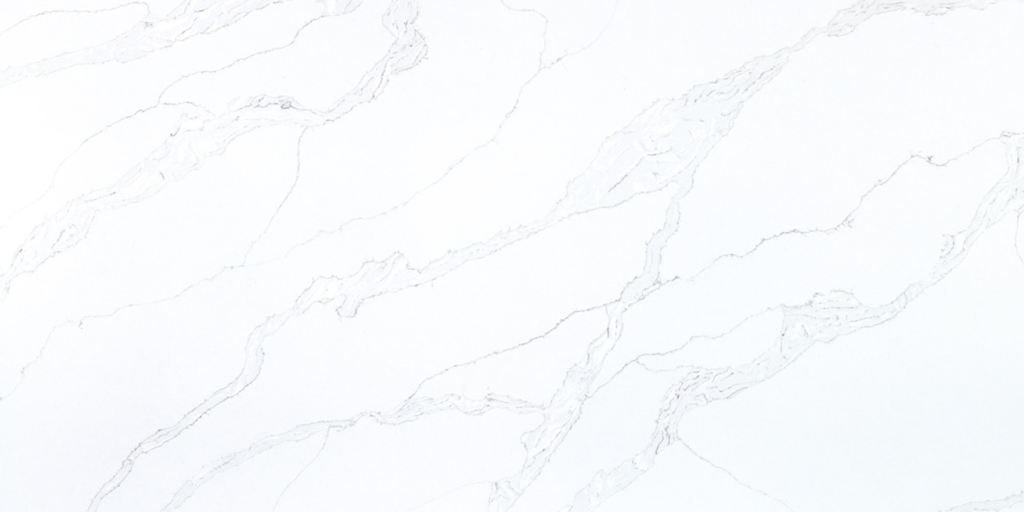 A white marble surface with subtle gray veining.