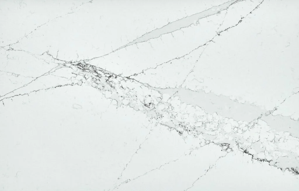 Close-up photo of white marble with gray veining.