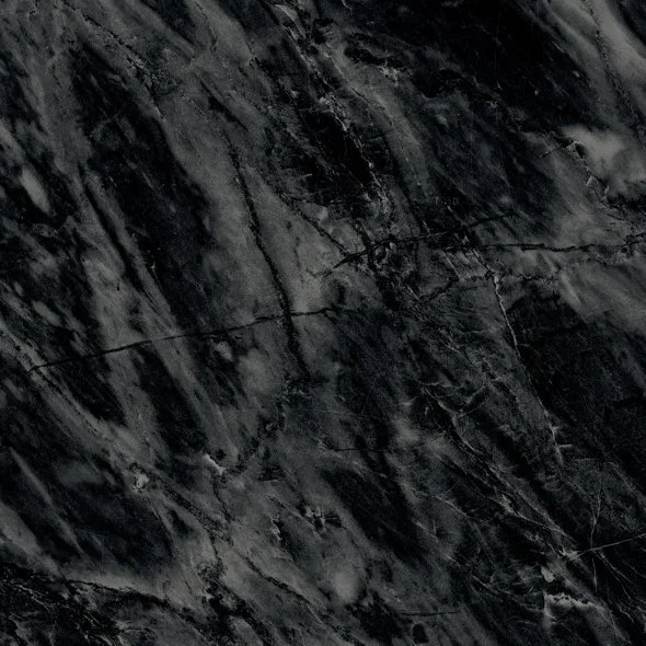 Close-up of a dark, textured stone surface with black and gray streaks and natural veining.