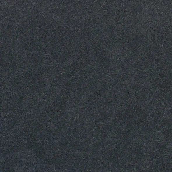 Close-up of a dark, textured surface