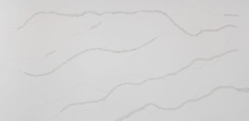 Close-up of white marble surface with subtle gray veining.