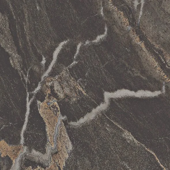 Close-up of a dark, textured stone surface with light-colored veins and cracks.