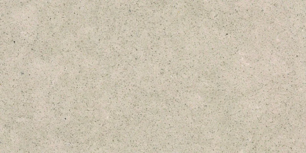 Close-up of a speckled beige surface, possibly a countertop or wall.