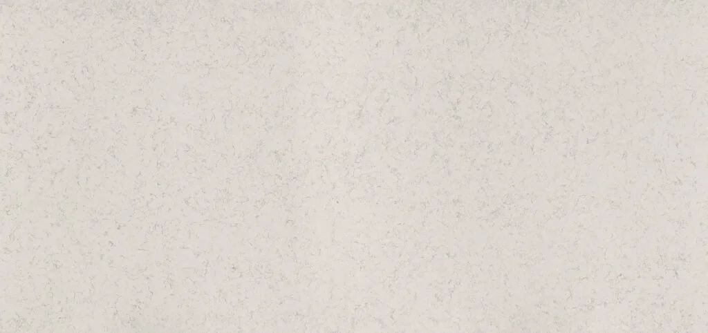 A plain, textured, beige wall.