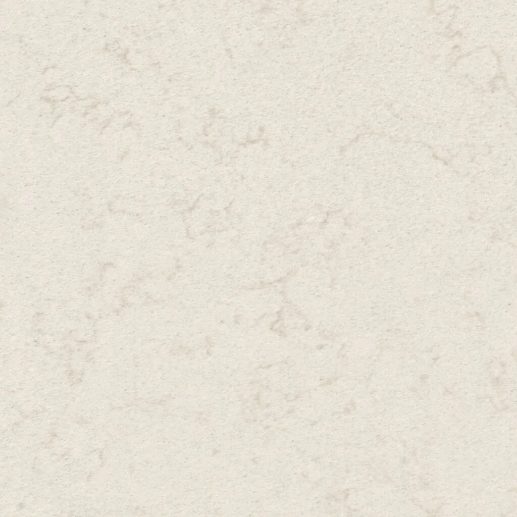 A close-up view of a textured, off-white surface, possibly a wall or paper with subtle irregularities.