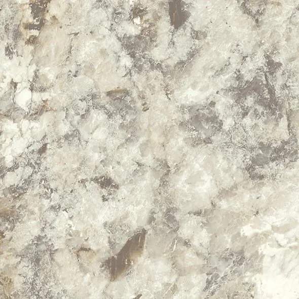 Close-up of a textured beige and light gray stone or marble surface.