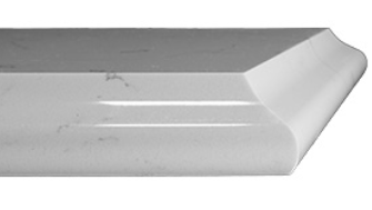 Close-up of a white plastic or metal object with a curved edge and slight scratches.