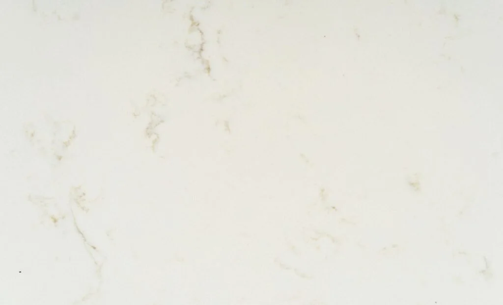 Close-up of a white marble surface with light brown veining.
