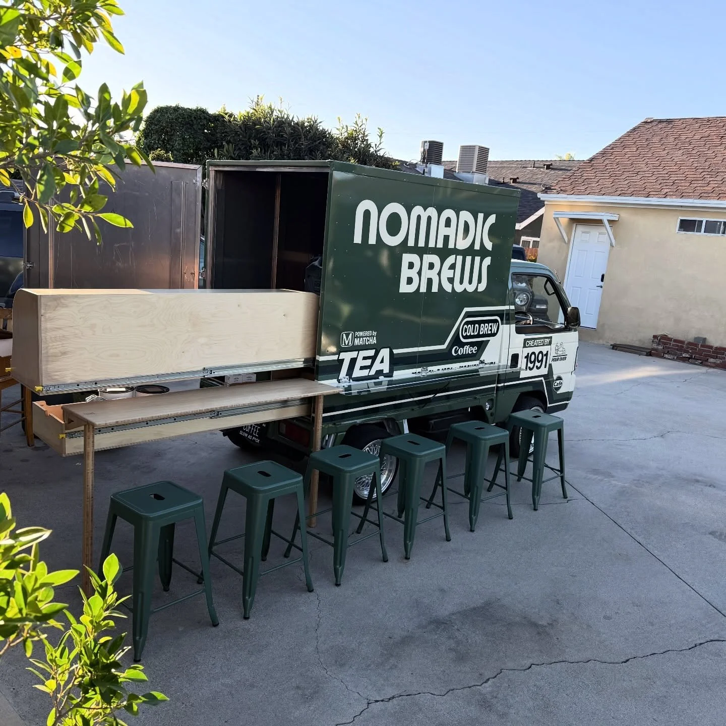 1/9/2026 - We've updated our bar stools to better fit the truck's vibe. Maximizing space is key in our setup, so we're utilizing vertical storage in the cargo box. Plus, our hot drinks are getting closer to finalized with our branding!