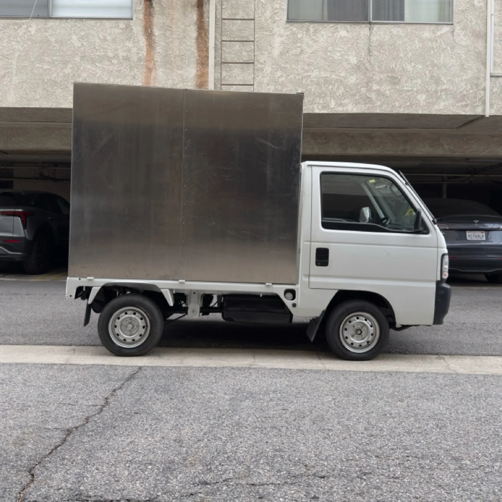 The cargo box was transformed into a functional space designed around service, storage, and efficiency.