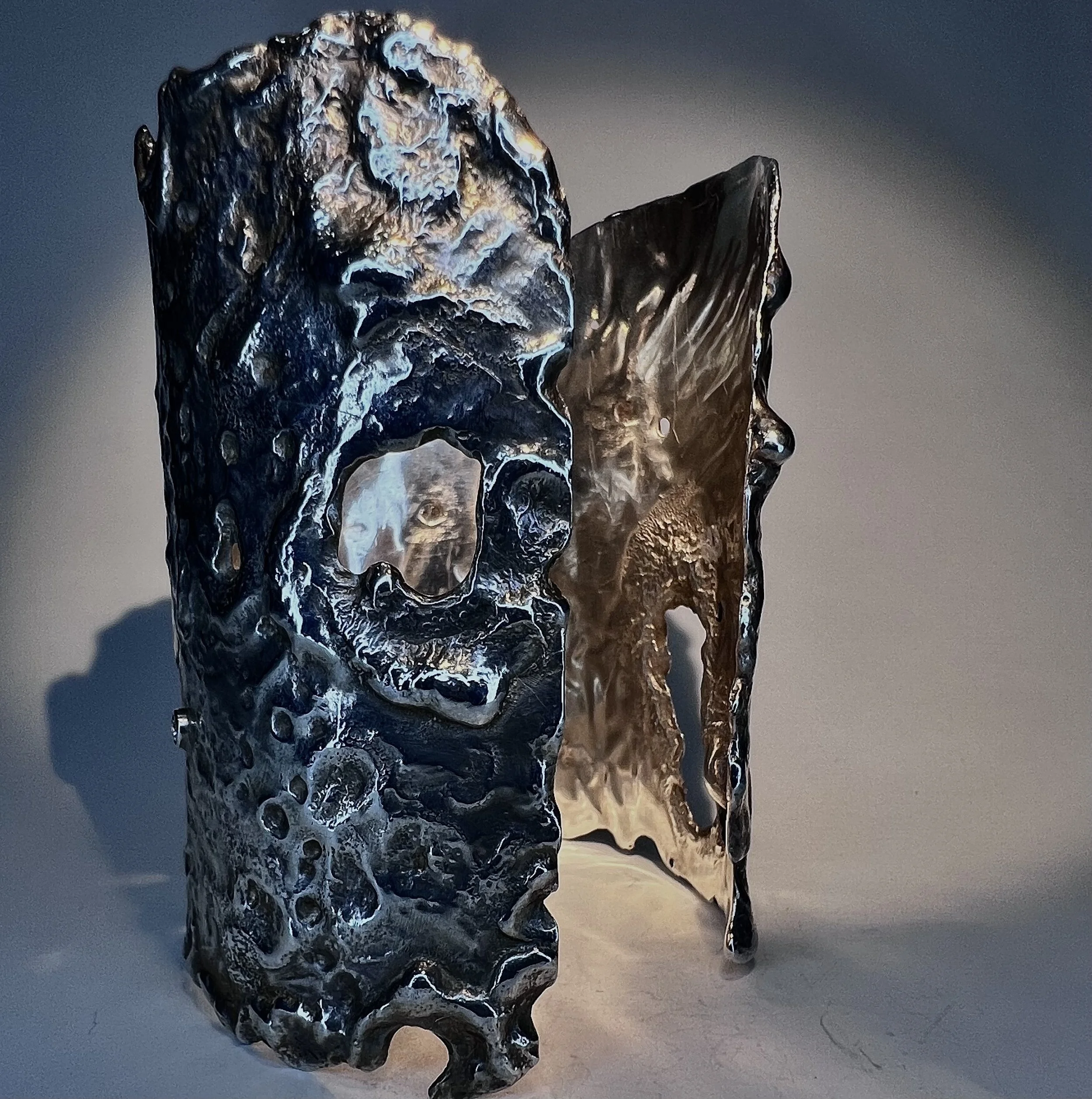 Close-up image of a metallic skull sculpture.