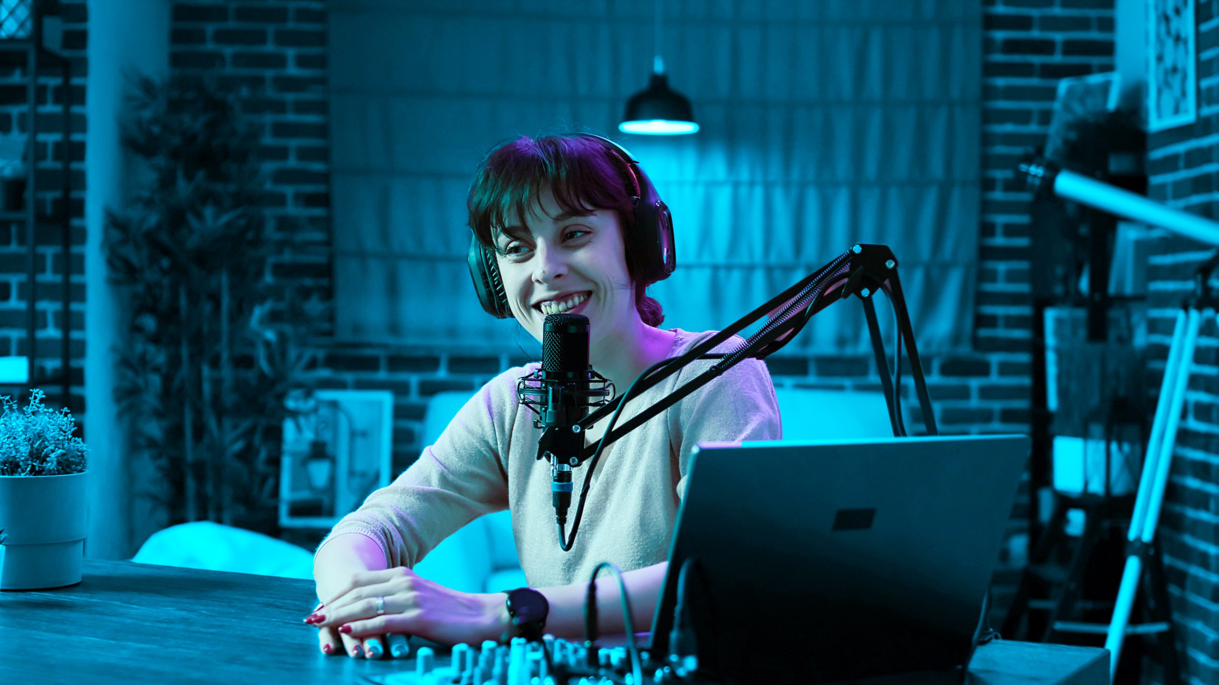 photo of a lady talking to a microphone