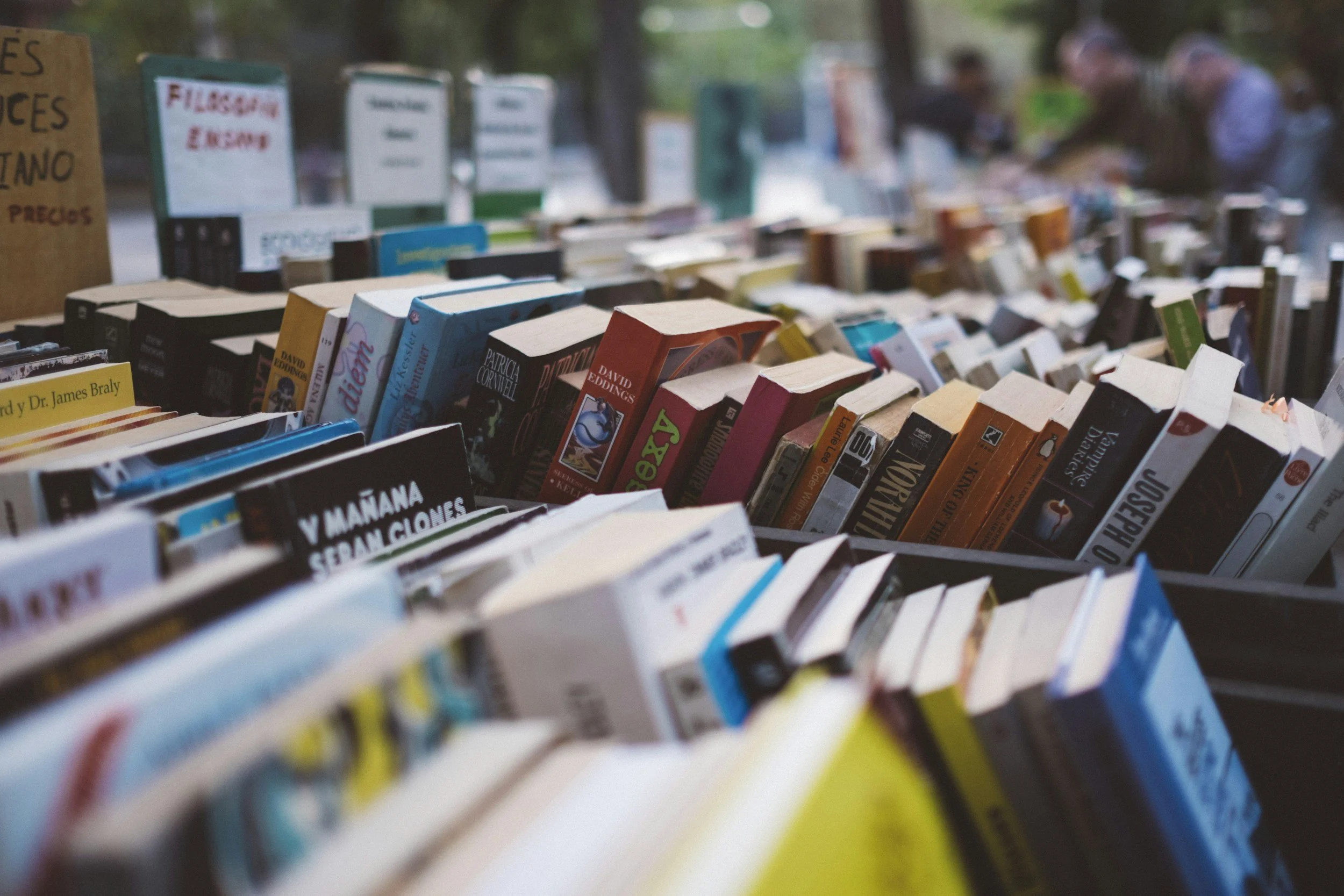 Rows of books in a cart for browsing