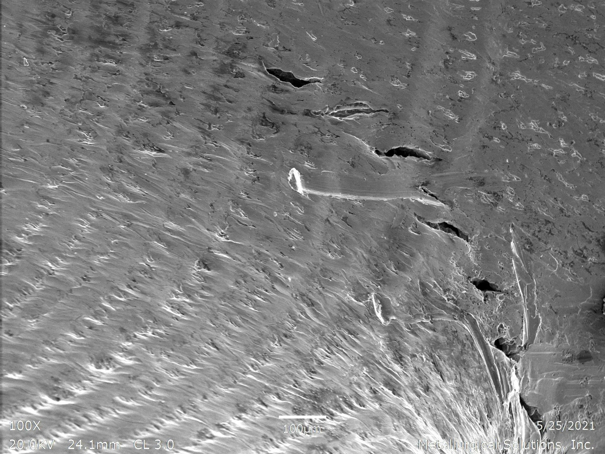 Solidification cracks showing fatigue striations and beach-mark morphology, scanning electron microscope SEM fractography evaluation identifying localized hot cracking and progressive cyclic separation within the same solidification crack sample per 