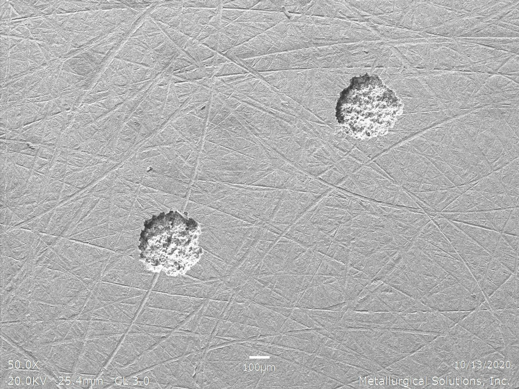 Isolated pitting corrosion SEI 50x, scanning electron microscope secondary electron imaging evaluation identifying localized pitting sites, surface pit initiation geometry, and porous oxidation remnants per ASTM G46 under ISO 17025 accredited laborat