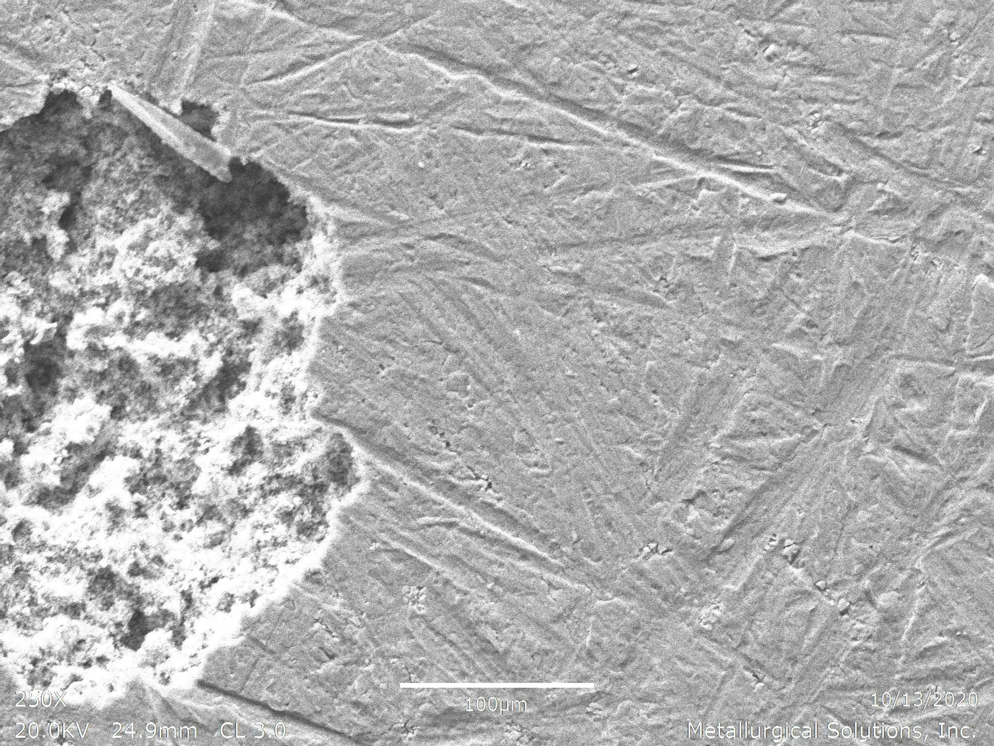 Localized pitting corrosion SEI 250x, scanning electron microscope secondary electron imaging evaluation identifying cavernous pitting degradation, porous corrosion product accumulation, and acicular microstructural phase morphology per ASTM G46 and 