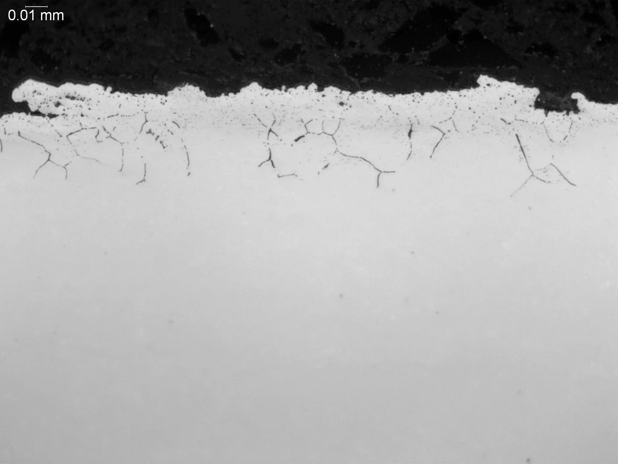 Intergranular oxidation (IGO) within an AISI 8620 case-hardened alloy matrix, metallographic cross-sectional evaluation identifying localized subsurface grain boundary oxidation networks, alloy element depletion zones, and fine microstructural degrad