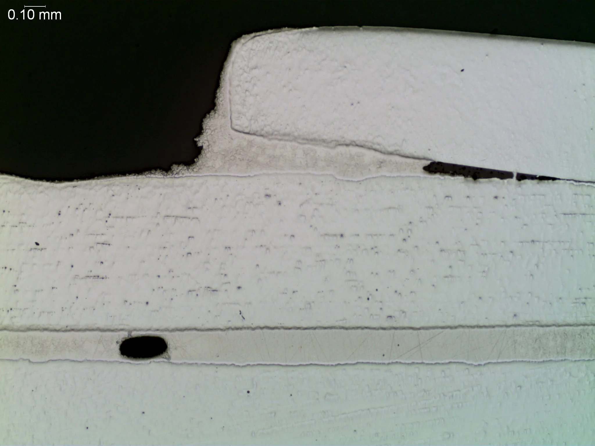 Incomplete braze fillet with joint voiding, metallographic cross-sectional evaluation revealing an irregular underfilled fillet profile and a horizontal unbonded interfacial void per AWS C3.8M and ASTM E3 under ISO 17025 accredited laboratory standar