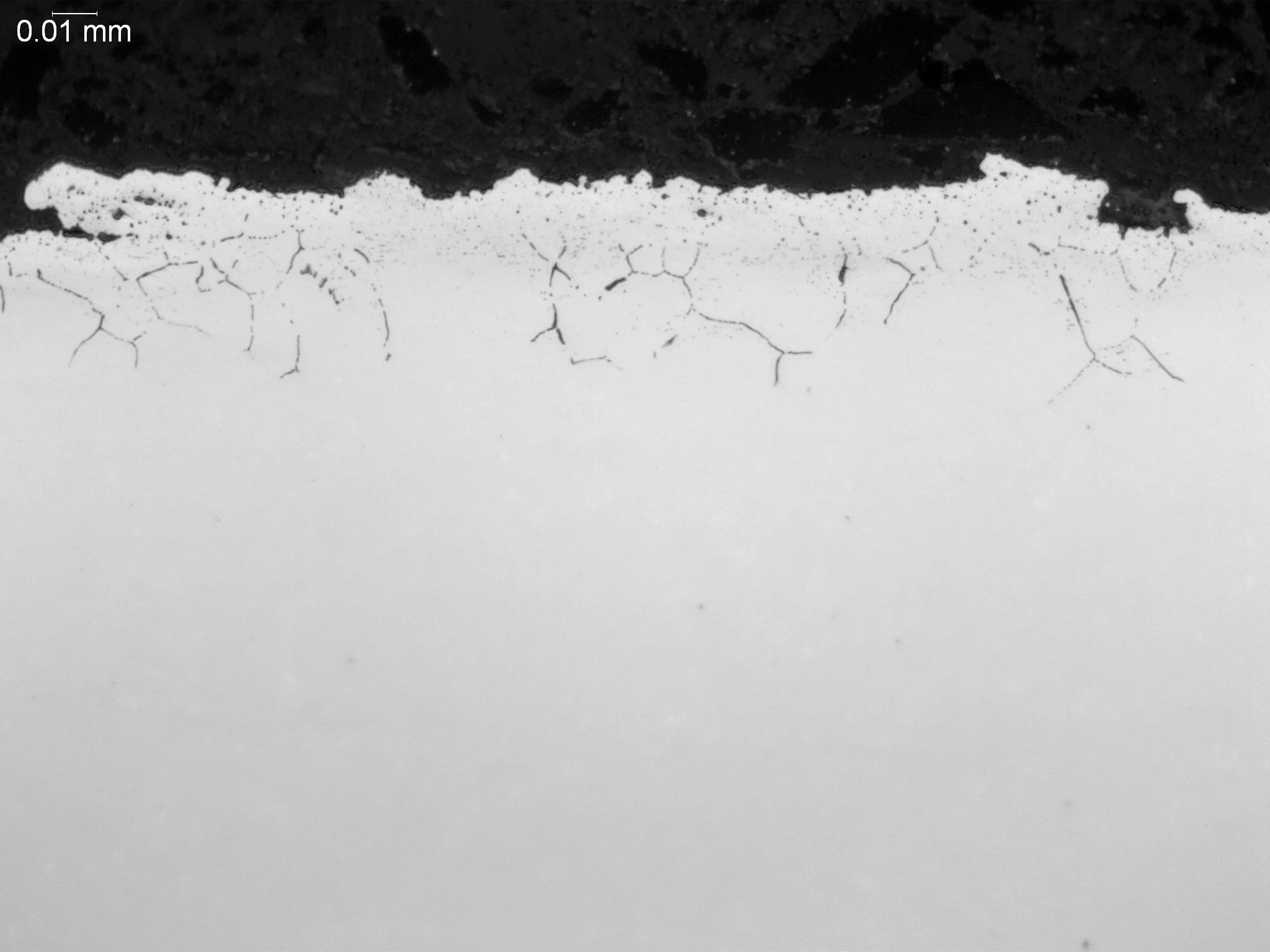 Intergranular oxidation (IGO) within an AISI 8620 case-hardened alloy matrix, metallographic cross-sectional evaluation identifying localized subsurface grain boundary oxidation networks, alloy element depletion zones, and fine microstructural degrad