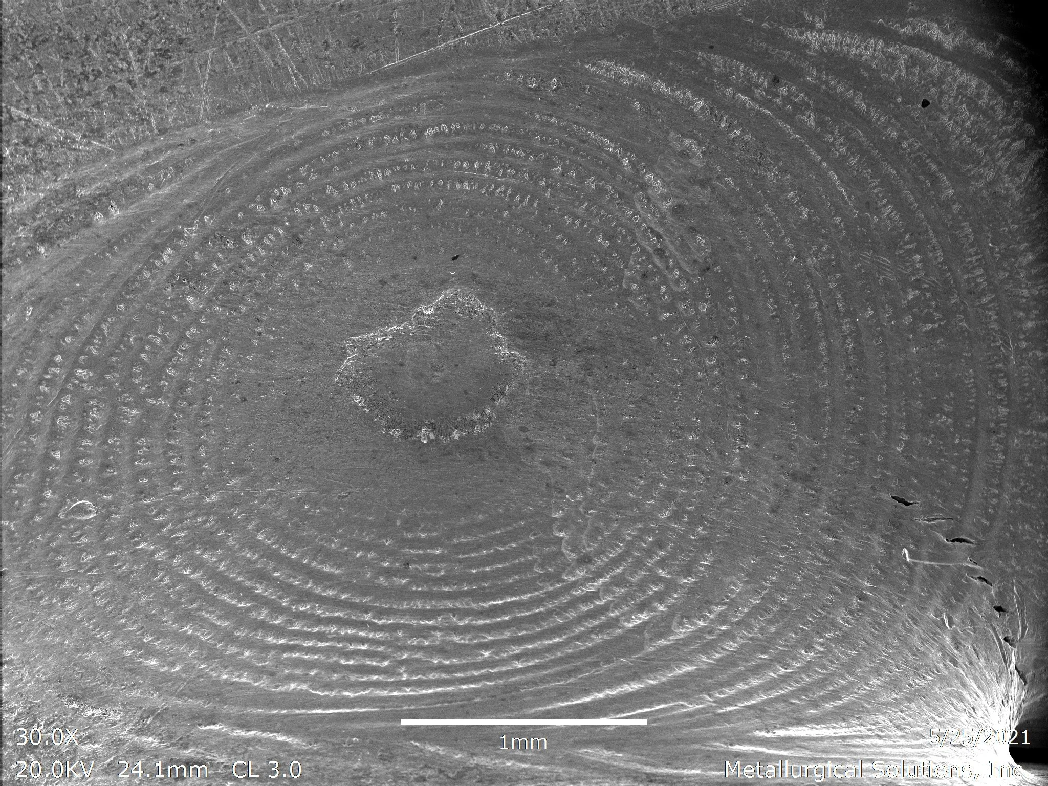 Solidification cracks showing a beach-mark progression, scanning electron microscope SEM fractography evaluation identifying hot tearing and solidification cracking propagating outward from a localized weldment fracture origin per ASTM E3 under ISO 1