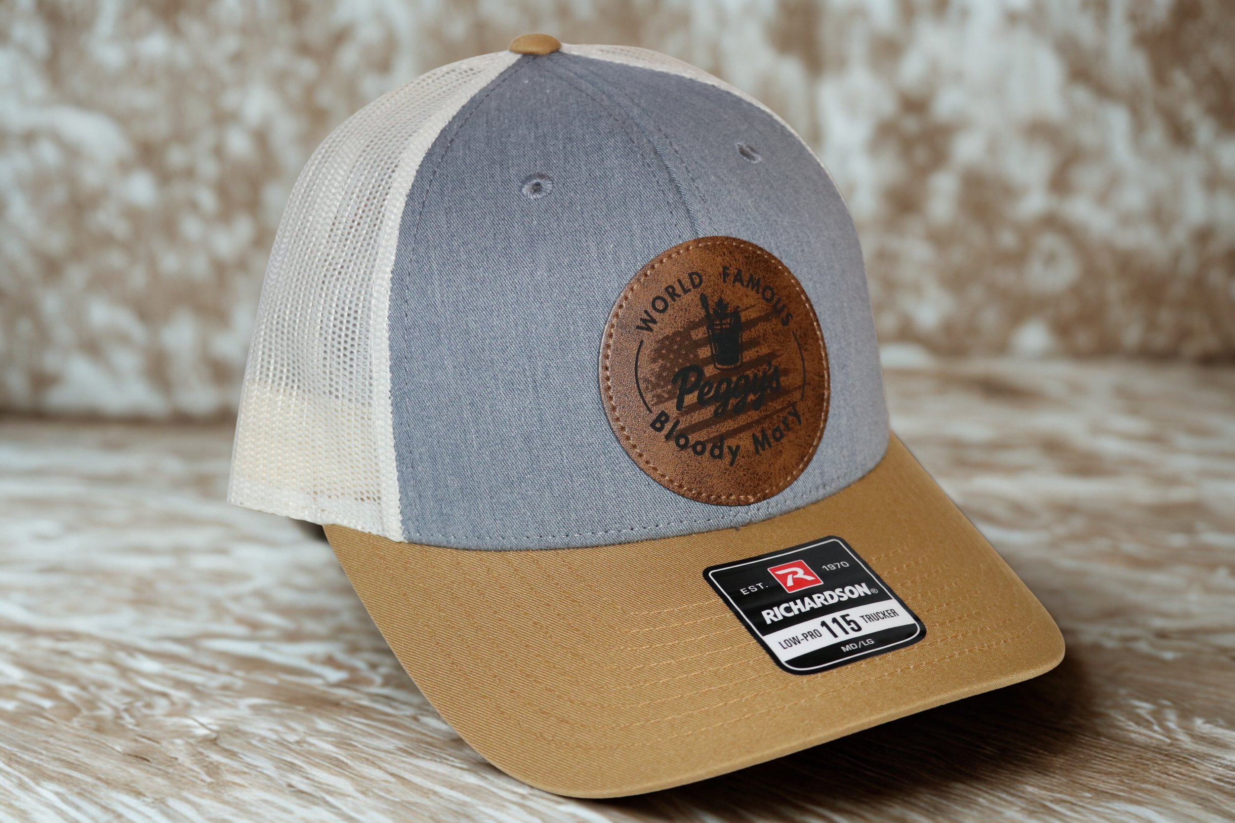 Peggy’s World Famous™ Bloody Mary Classic Trucker Hat –Tan/grey/white