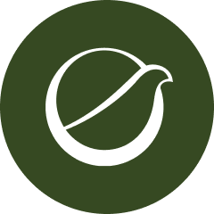 Green circular icon with a white abstract shape resembling a stylized fruit or seed.