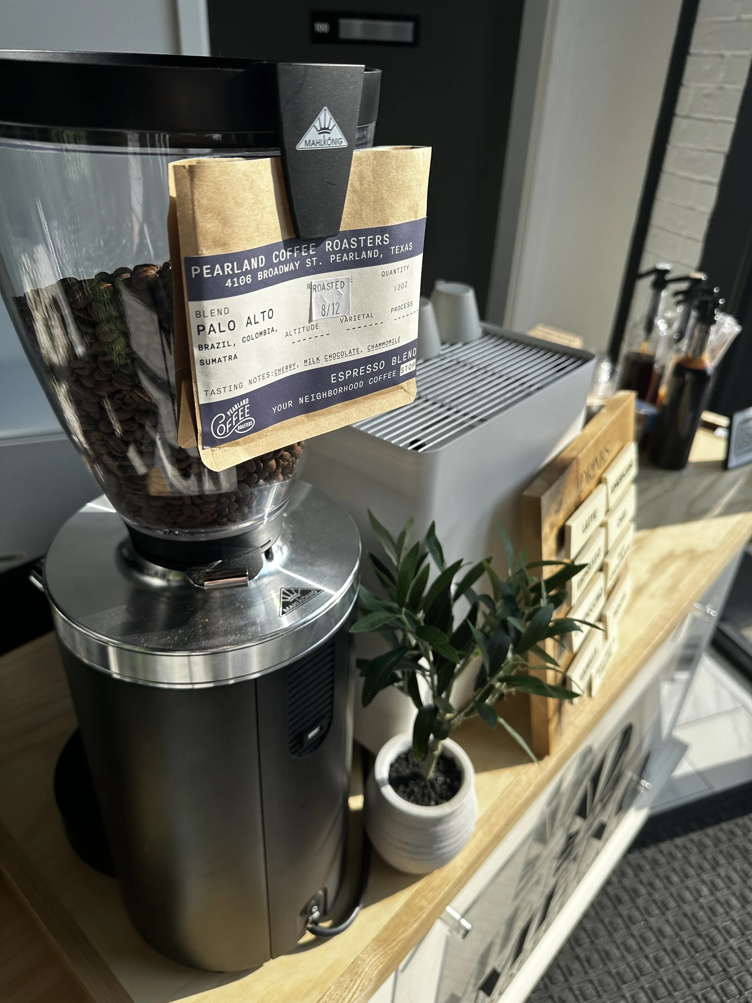 Coffee station with a bag of coffee beans and a coffee maker on a wooden counter Coffee Catering in Houston, Texas Coffee Cart and Mobile Espresso Bar Event Baristas. Coffee Vendor Services