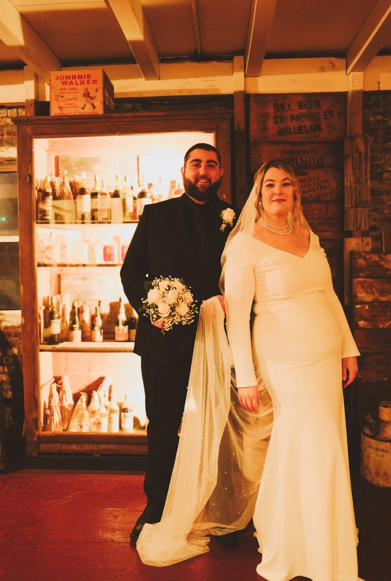 Couple posing during their wedding celebration in Saint Pierre and Miquelon at the Heritage Museum.