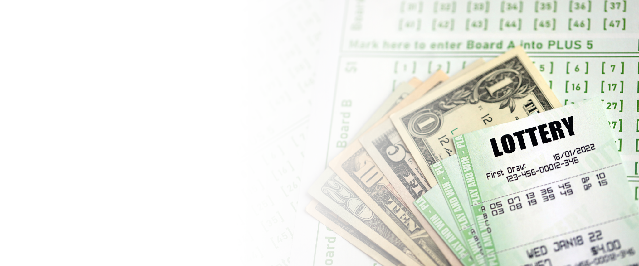 A pile of U.S. dollar bills, including a one-dollar bill, placed on a lottery ticket and a betting slip.