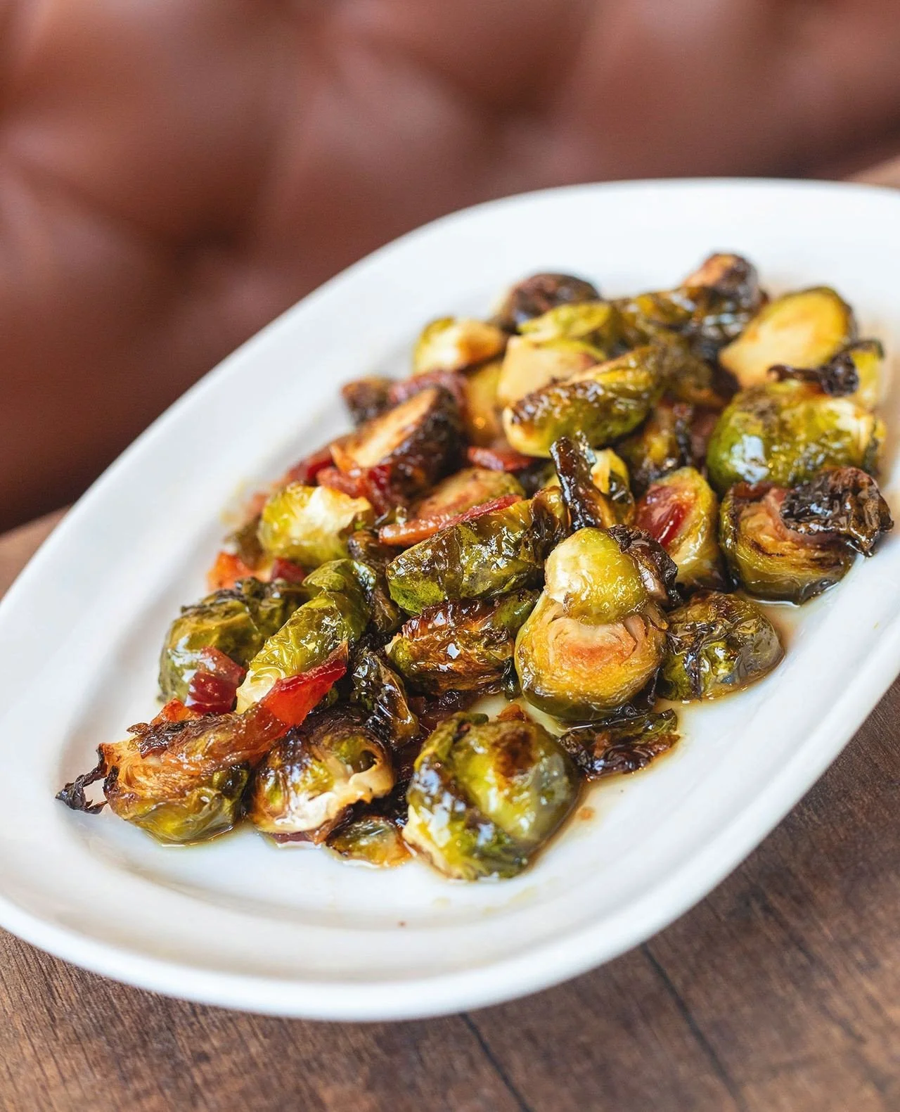 What's your favorite app on the new Fall menu and why is it the Roasted Brussels Sprouts with brandy maple glaze and bacon?