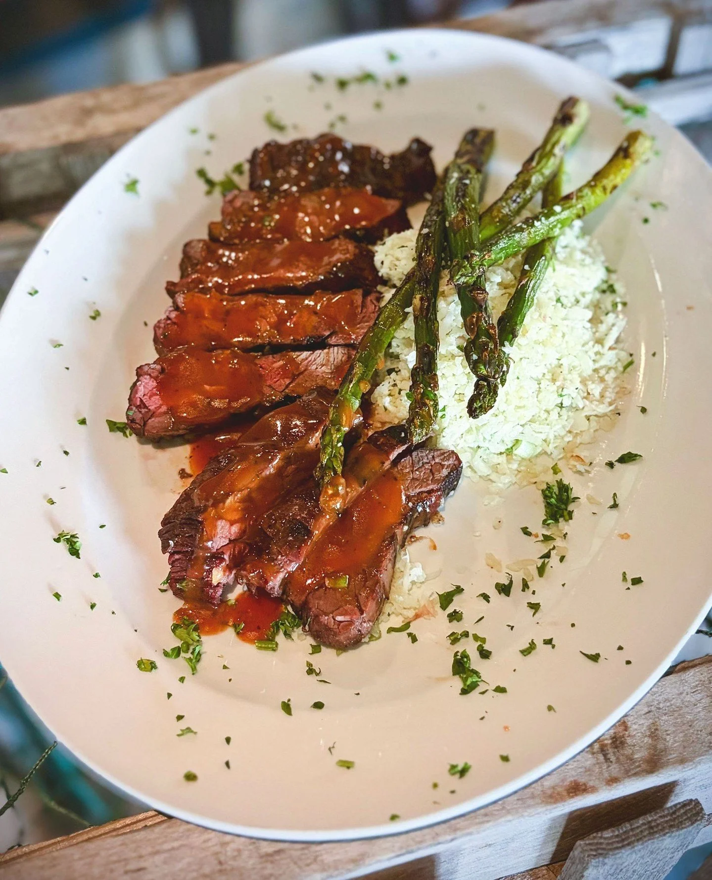 Chef's special Bavette Steak is served with sweet bourbon sauce, riced cauliflower, and grilled asparagus&mdash;perfect for summer evenings.⁠
⁠
Add a few (or a dozen) $1.50 oysters to start and settle in. Walk-ins are always welcome.