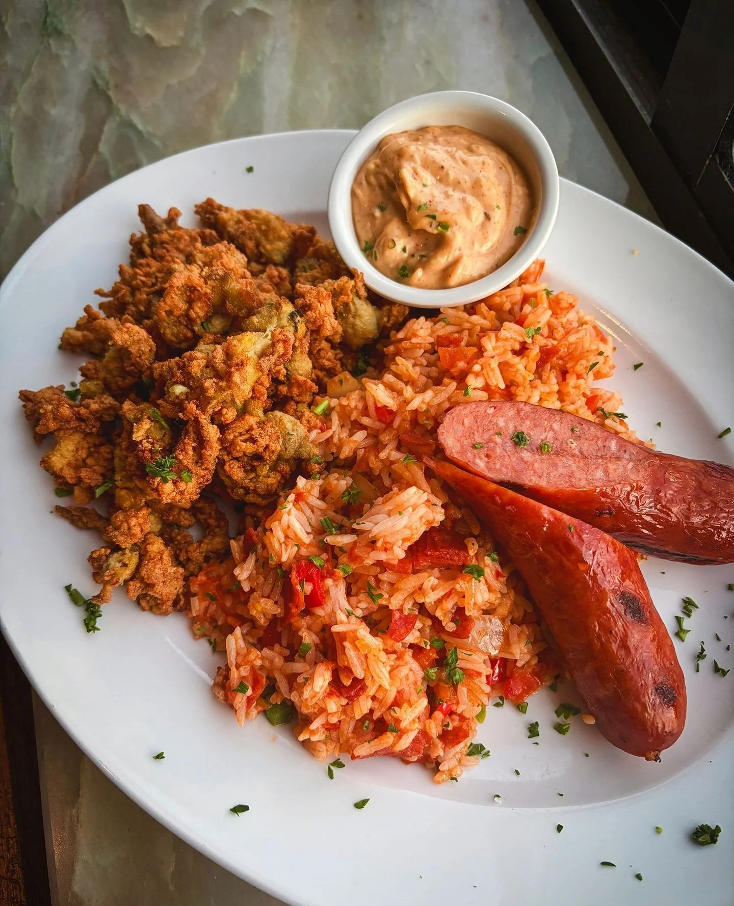 We're bringing a little taste of New Orleans to Green Island this weekend with our latest chef special⚜️NEW ORLEANS SURF &amp; TURF⁠
⁠
Crispy fried whole belly clams, smoky grilled andouille sausage, dirty rice, and Cajun tartar sauce. Southern comfo