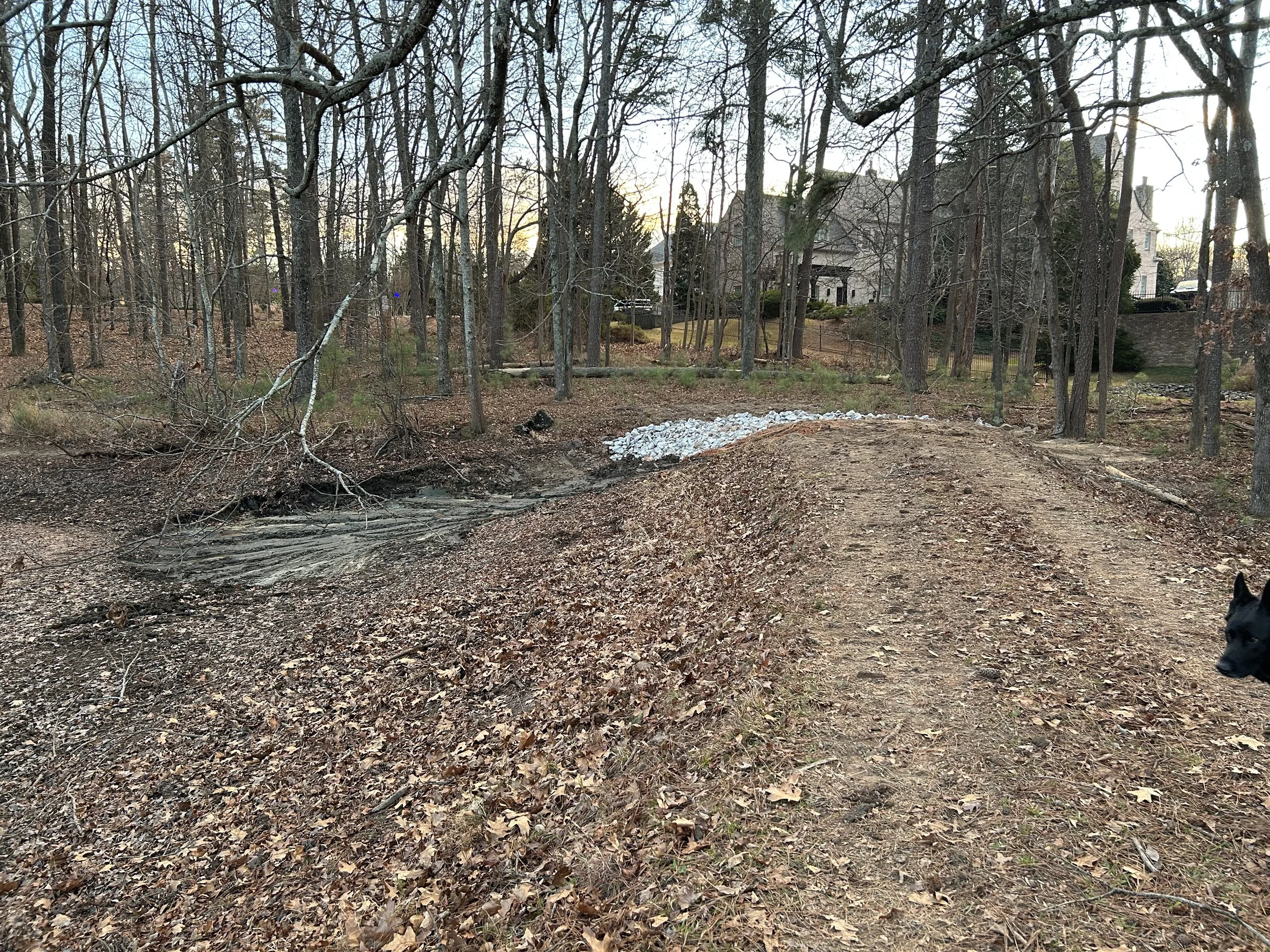 Emergency spillway area during reconstruction after sediment was removed from the spillway entrance.