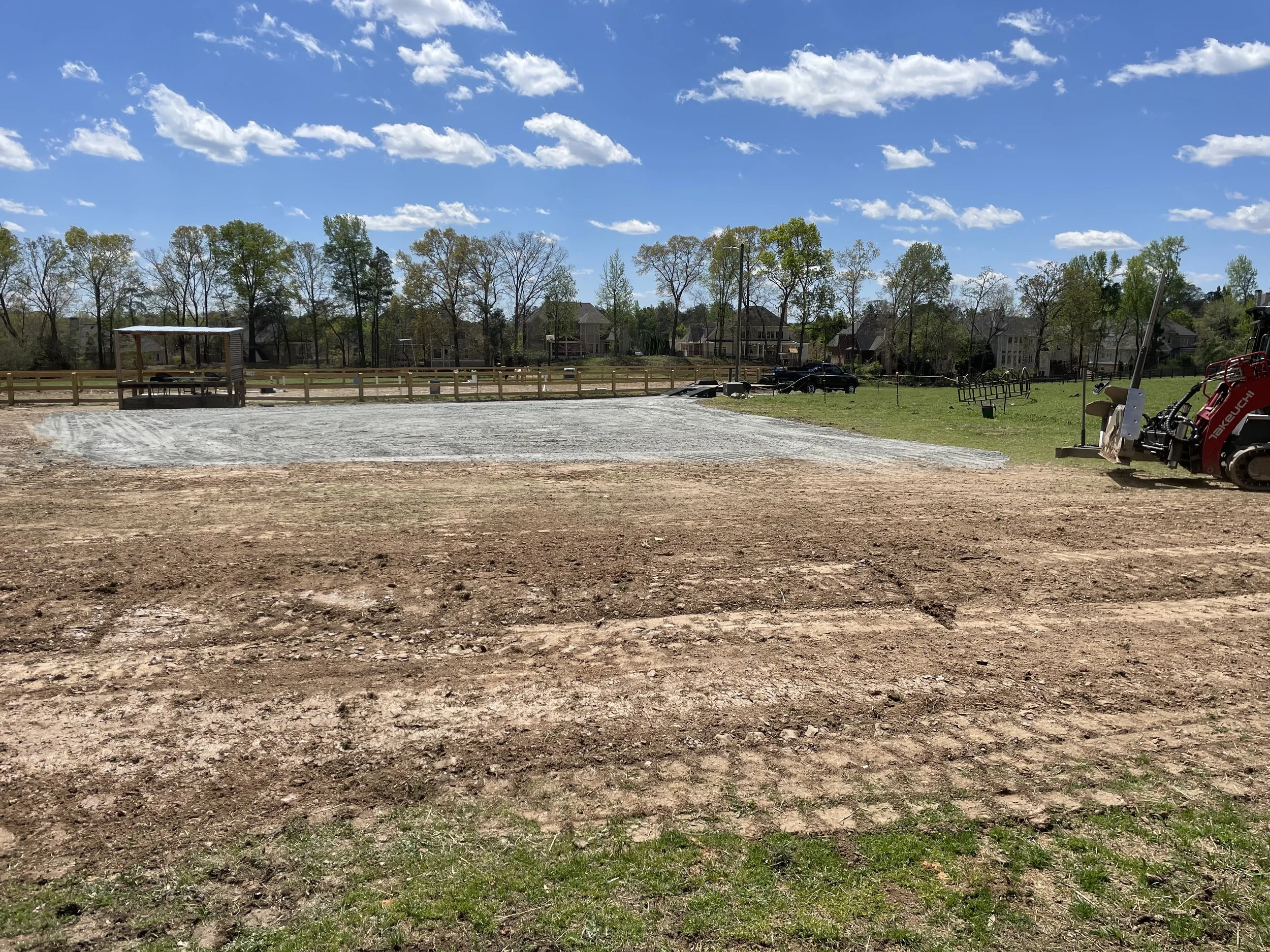 Upper edge of new parking area with gentle diversion swale intercepting pasture runoff in Marietta, GA