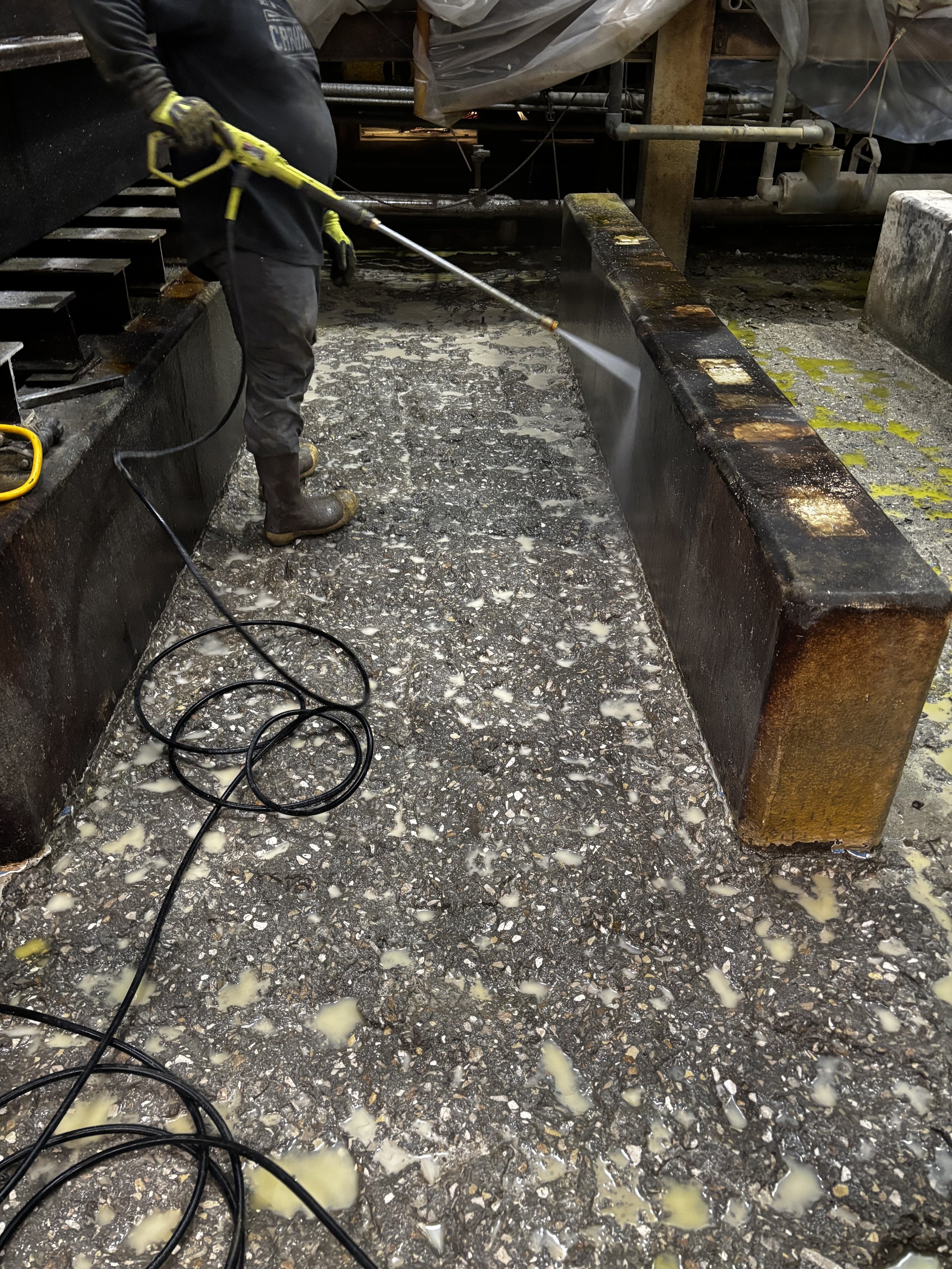 Concrete demolition progress removing deteriorated material to prepare for durable, long lasting restoration.