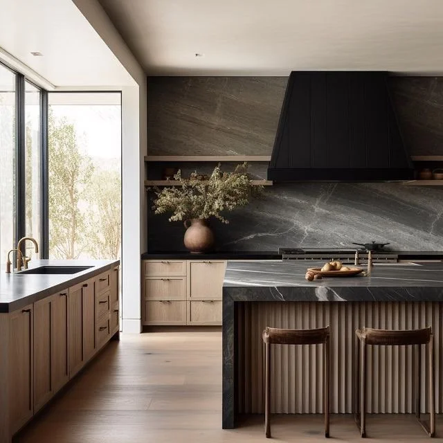 Modern kitchen with black marble countertops, a large window, and light wood cabinetry