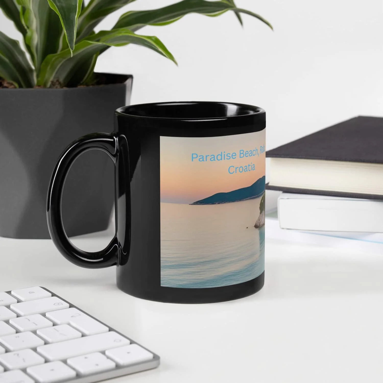 Paradise Beach Coffee Mug 11oz and 15oz next to a small plant in front of a laptop, tropical ceramic coffee mug gift for teachers and beach lovers