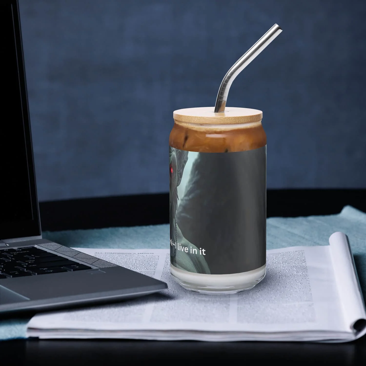 Left view of 16 oz can-shaped glass with lid and straw on a table