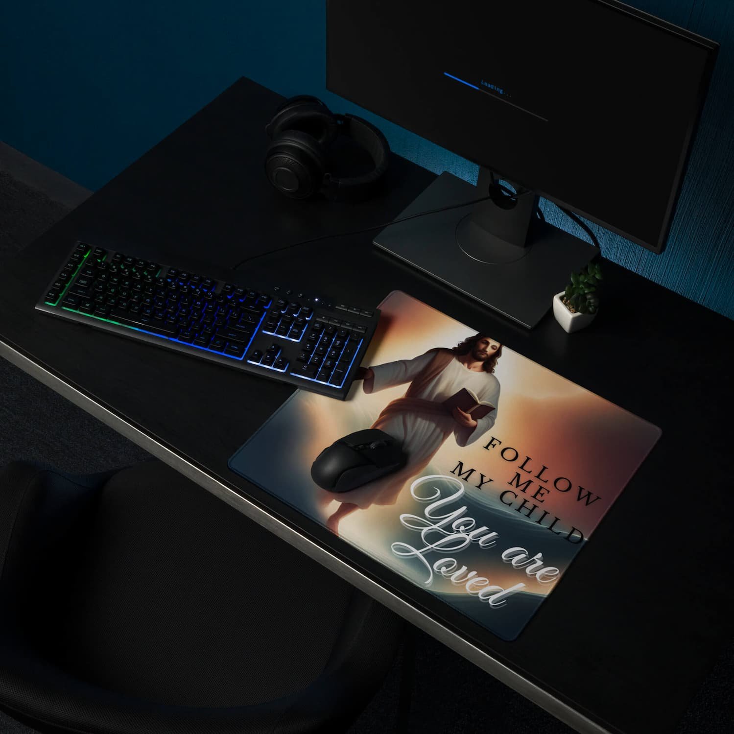 Extended gaming mouse pad featuring Jesus walking in the clouds with the message “Follow Me My Child,” shown with a keyboard and mouse on the desk mat